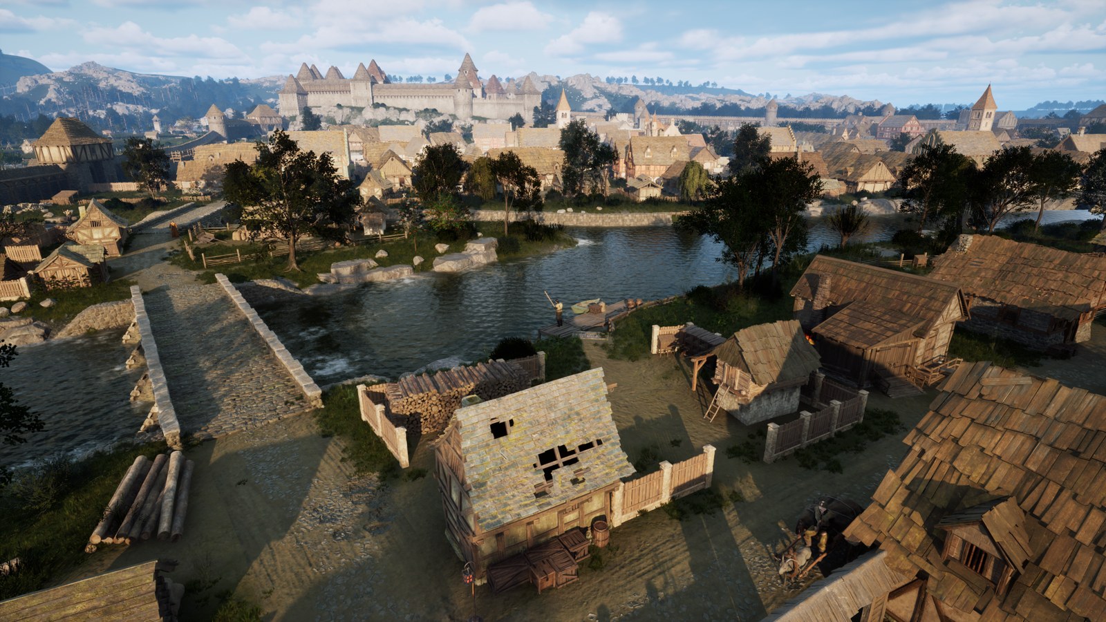 A medieval town seen from above in The Guild Remake Europa 1410: timber and stone houses with shingled roofs along a river, a stone bridge, stacked logs and a cart in the foreground, and a walled inner city with towers and a large church rising behind it under a blue sky