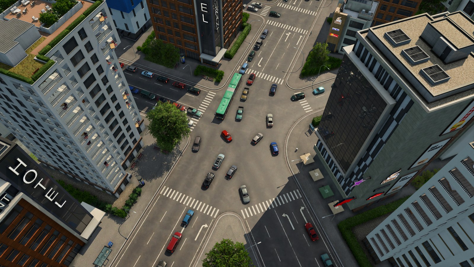 An overhead view of a downtown crossroads between tall buildings, crowded with cars and a green bus, with pedestrian crossings on every side